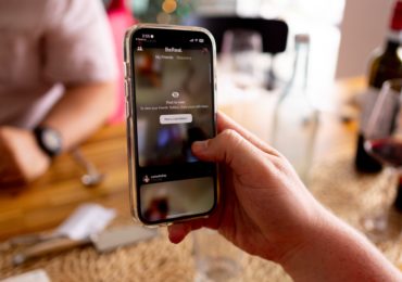 holding-phone-with-bereal-app-open-about-to-take-picture