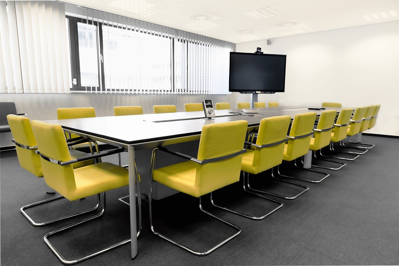 Meeting table with yellow chairs