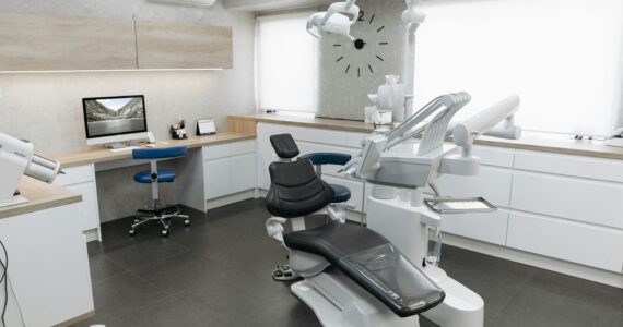 Modern dental clinic with a clean treatment chair, advanced equipment, and bright natural lighting, representing affordable international healthcare options.”
